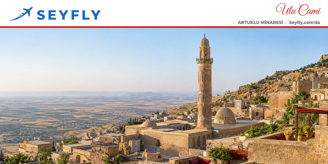 Mardin Ulu Camii'nin taş evler arasında yükselen oymalı minaresi